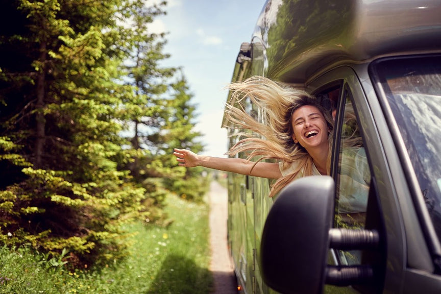 A person improving indoor air quality in their RV while traveling.