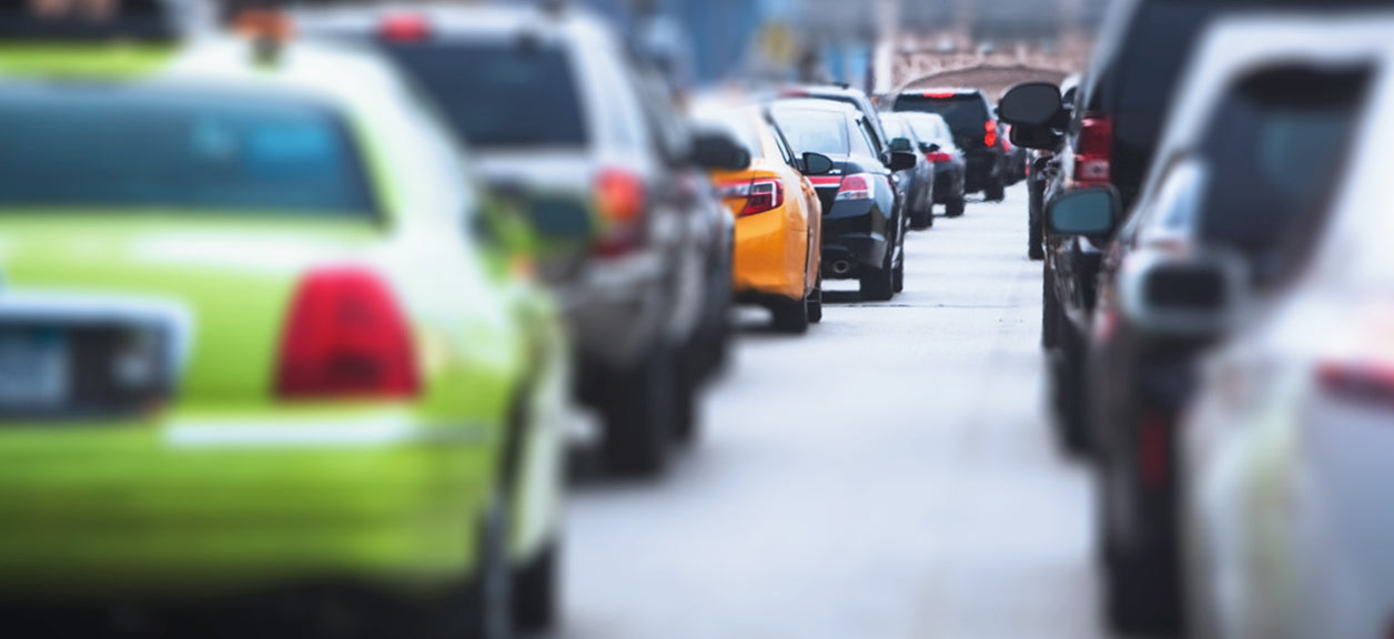 Cars in traffic showing auto pollution.