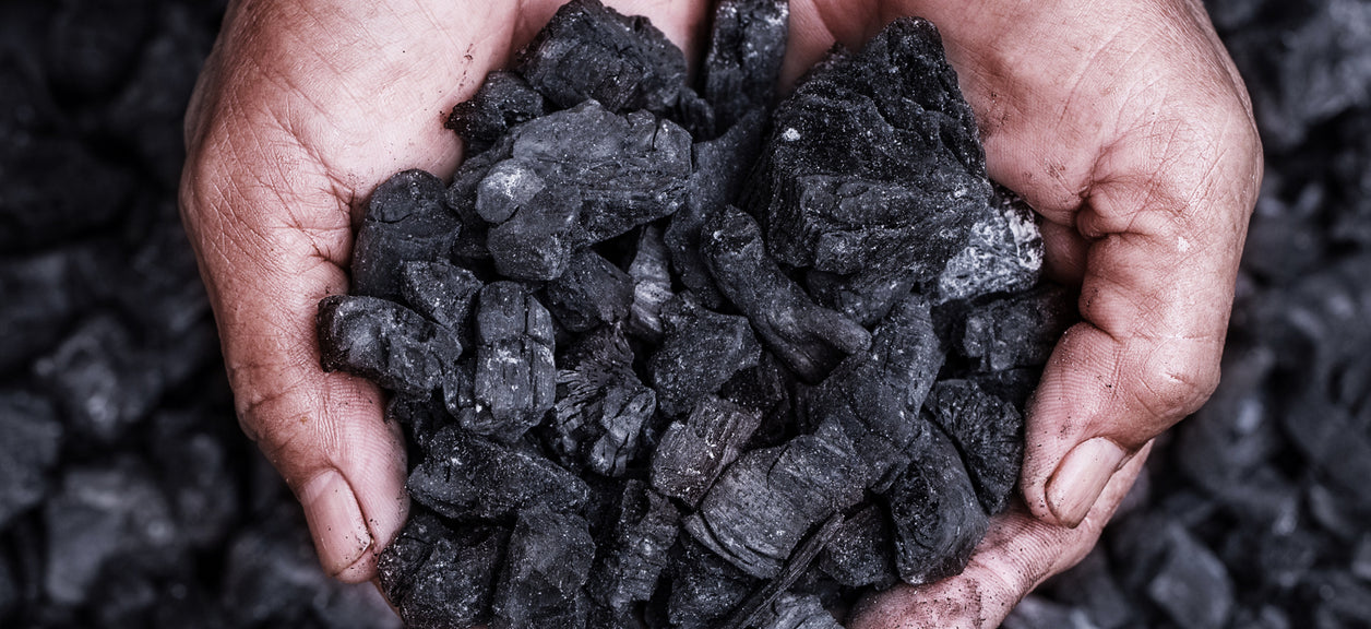 What is activated carbon? This image shows hands holding activated carbon