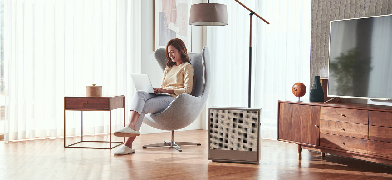 A person wondering: Do I Need an Air Purifier?