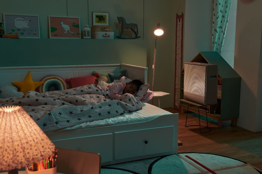 A child sleeping near an Airmega 250.