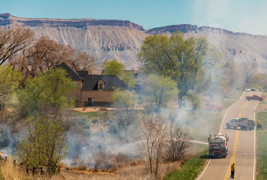A home surrounded by wildfire smoke.