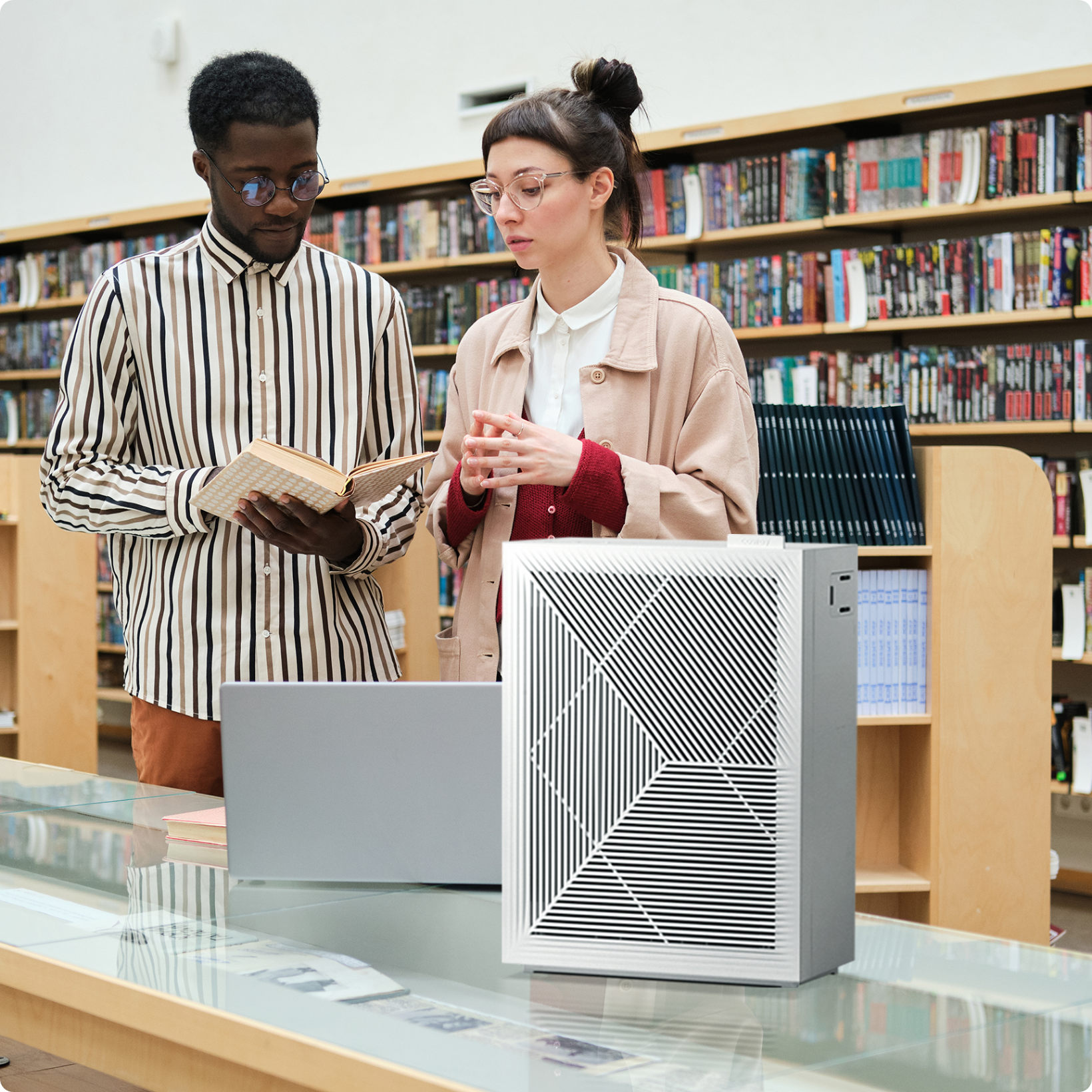 People reading in library with Airmega air purifier