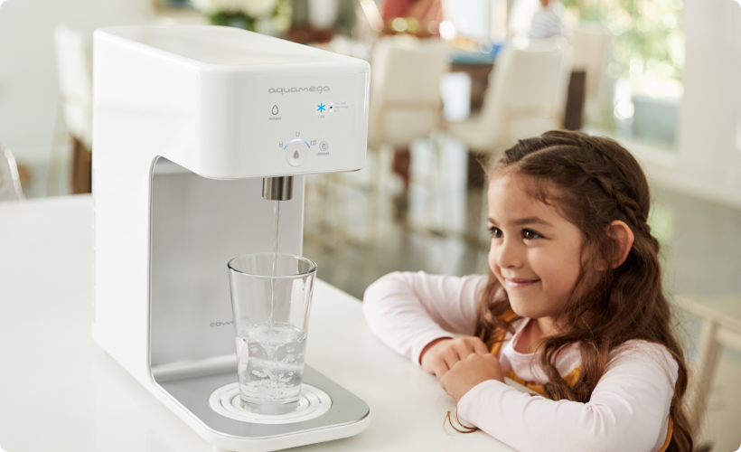 A child watching the aquamega pouring water