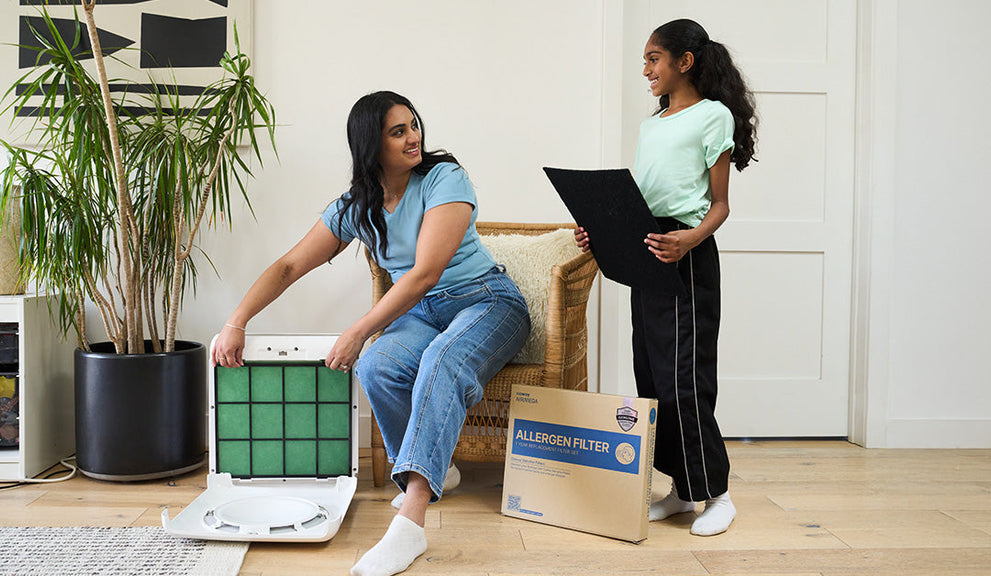 A mother and daughter with air purifiers.