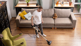 A person cleaning before National No Housework Day.