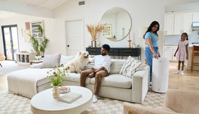A family with a dog and Airmega 350