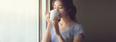 woman drinking from a mug
