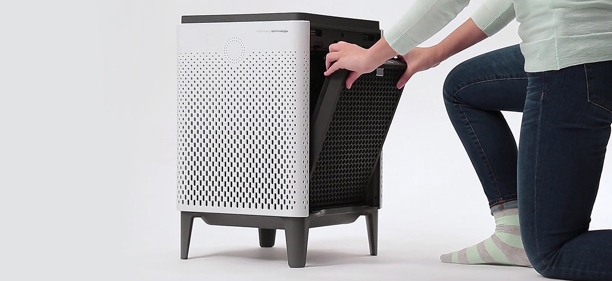 A person replacing coway airmega filter learning the importance of changing a HEPA filter on time.