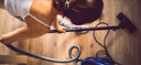 woman vacuuming house