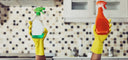arms holding cleaning supplies