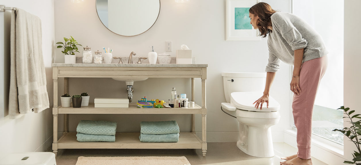 woman opening bidet toilet seat