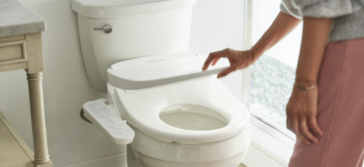 person opening up bidet toilet seat