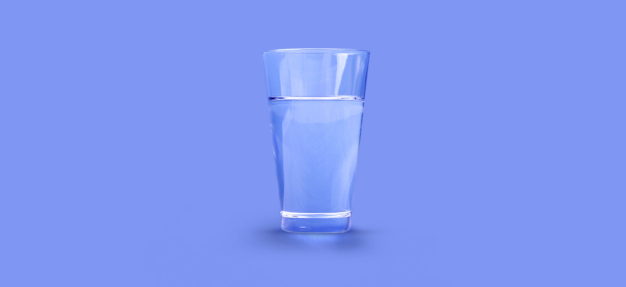 glass of water on purple background