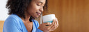 woman smelling coffee