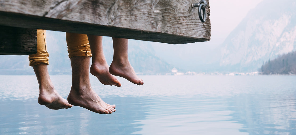 feet hanging off dock