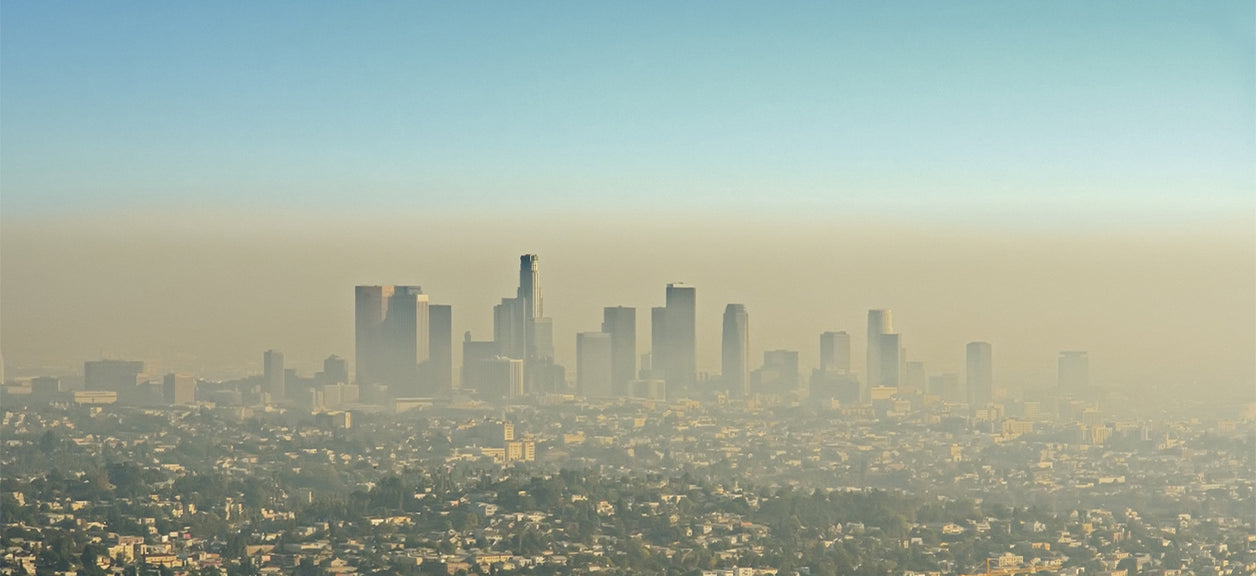 city in behind heavy smog