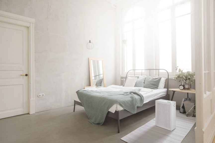 A bedroom with an Airmega 150 in Dove White.