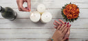 hands lighting a candle