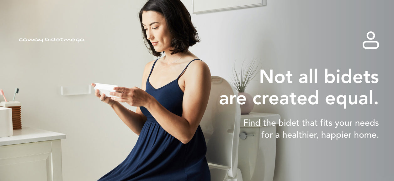 woman sitting on toilet seat holding bidet control