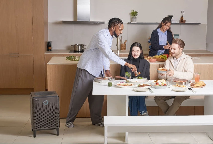 A group learning to boost mood naturally with an AirMega 400s.