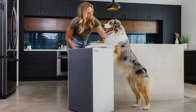 A woman with her pet and the Airmega ProX