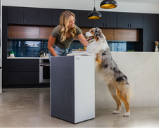 A woman with her pet and the Airmega ProX