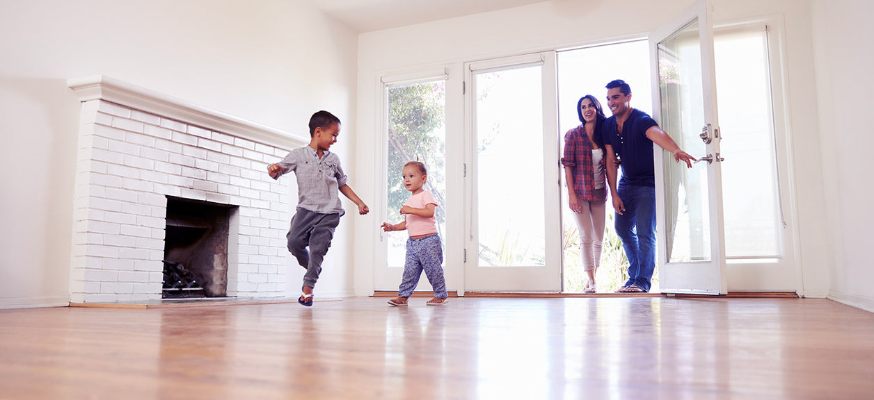 Family running in new empty home
